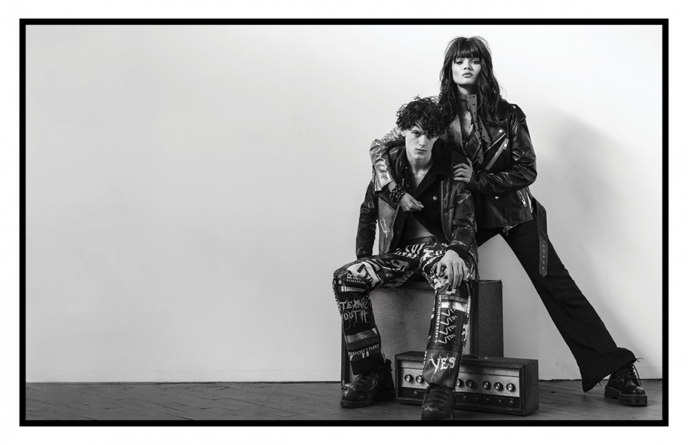 Michael wears Patterned jacket / CoSTUME NATIONAL Black jacket/ Frame Denim Trousers / Devon Halfnight Leflufy Shoes / Dr. Martens Daniela wears Black jacket / 3.1 Phillip Lim Metallic jacket / John Galliano Top / Sally Lapointe Trousers / Calvin Klein Collection Scarf / Hue Bracelet / Ben-Amun Shoes / Dr. Martens