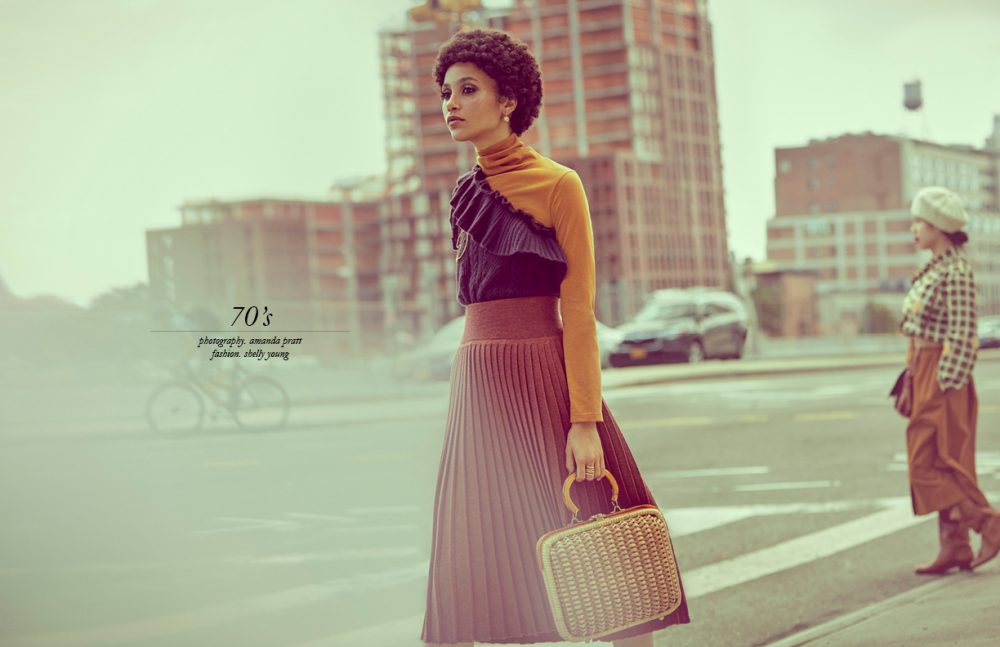 Turtleneck / No. 6  One shoulder jumper / Ulla Johnson  Skirt / Hesperios  Brooch & rings / We Who Prey  Bag & earrings / Stylist’s Own (vintage)